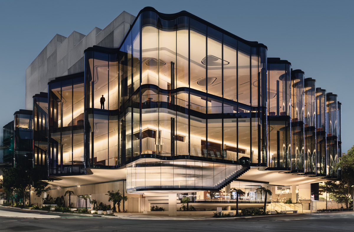 Glasshouse Theatre illuminated exterior at blue hour · photography by Jason Romeo