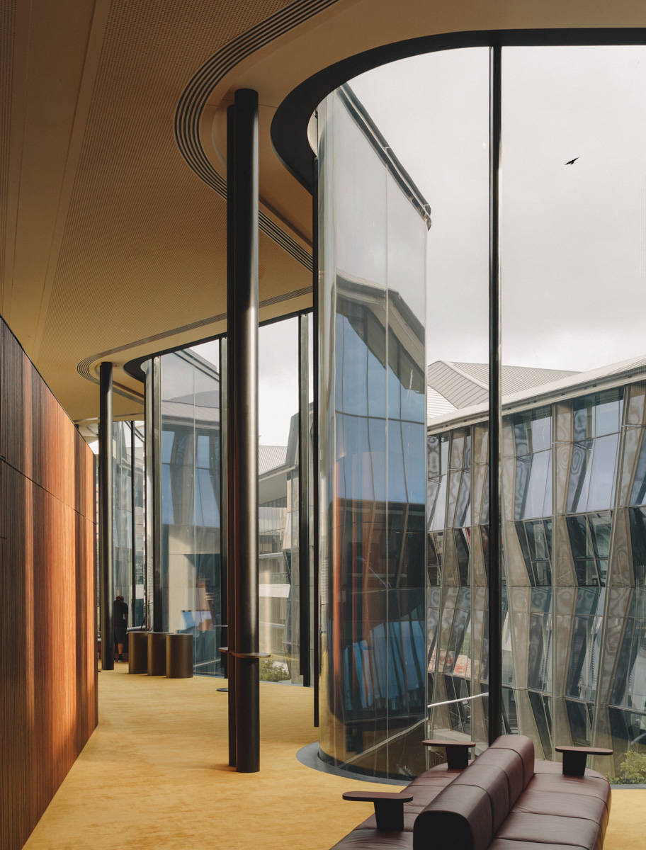 Glasshouse Theatre foyer with curved glazing and timber walls · photography by Jason Romeo