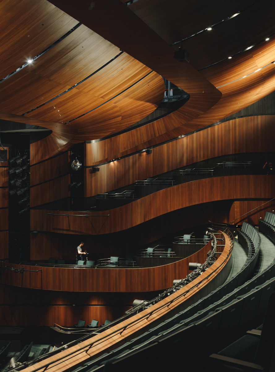 Glasshouse Theatre auditorium with curved timber balconies · photography by Jason Romeo